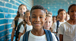 Boy, student and happy portrait with children in primary school or kindergarten for learning education and social interaction. Classmates, learners and diversity on campus for growth and development.