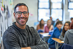 Teacher portrait and man in class at high school for physics, education or teaching students. Happy, person and learning science and study chemistry in classroom for development or growth with mentor