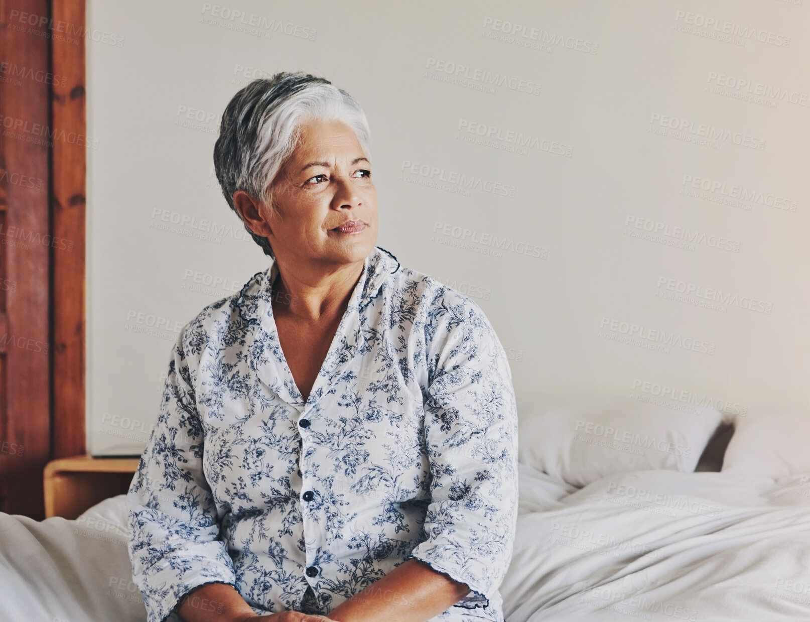 Buy stock photo Memory, retirement and thinking with senior woman in bedroom of home for nostalgia of past. Alzheimers, dementia and mental health with elderly person on bed in apartment for grief or loneliness