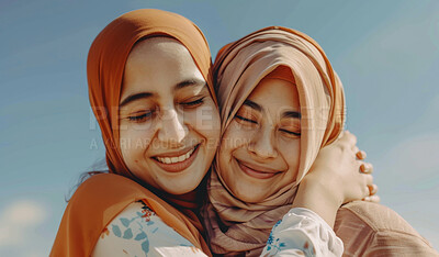 Buy stock photo Outdoor, hijab and Islam women with hug for bonding, appreciation and happy together by blue sky. Muslim friends, caring and support with smile for gratitude, embrace and friendship with commitment