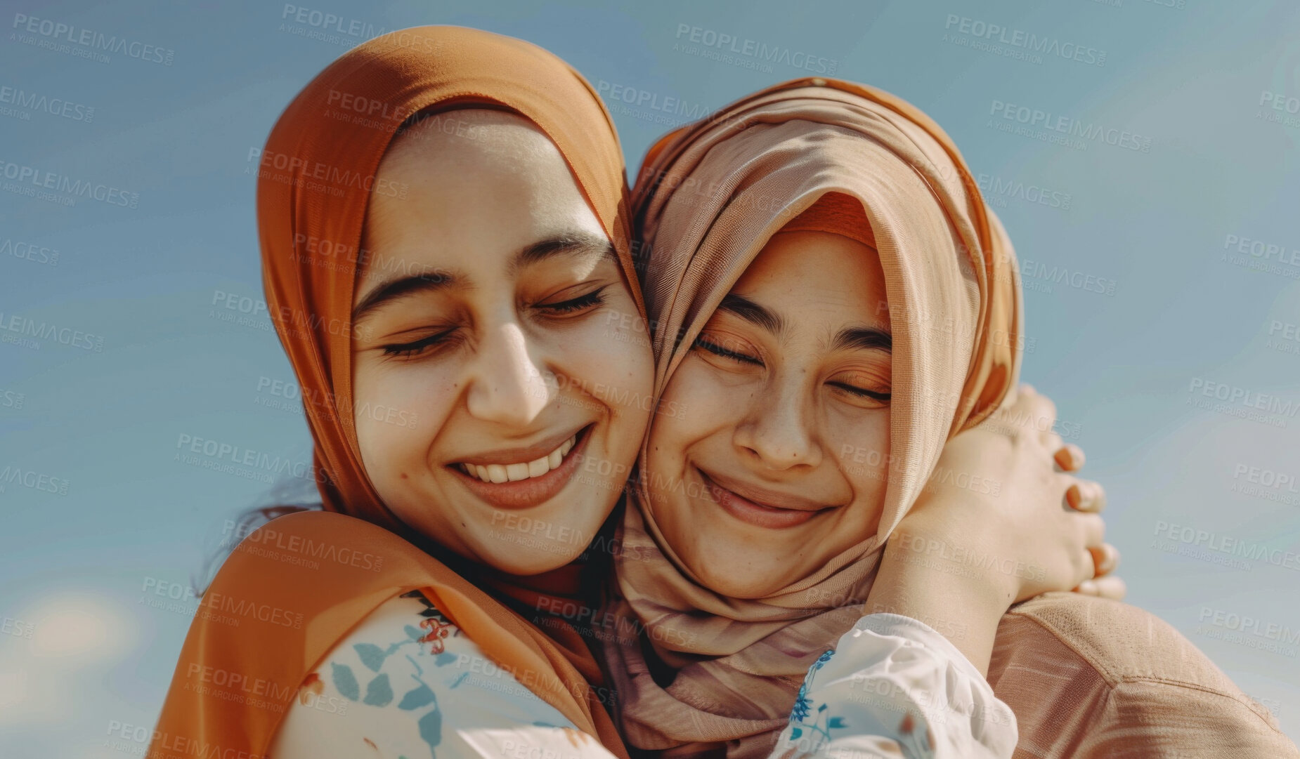 Buy stock photo Outdoor, hijab and Islam women with hug for bonding, appreciation and happy together by blue sky. Muslim friends, caring and support with smile for gratitude, embrace and friendship with commitment