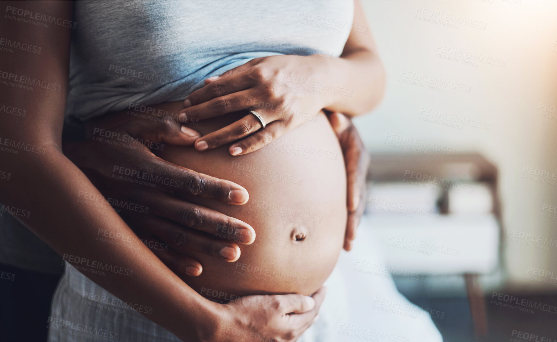 Buy stock photo Pregnant, love and couple hands on stomach in house for support, security and safety, nurture and protection. Future, family and people hug at home with tummy growth touching, gratitude and bonding 