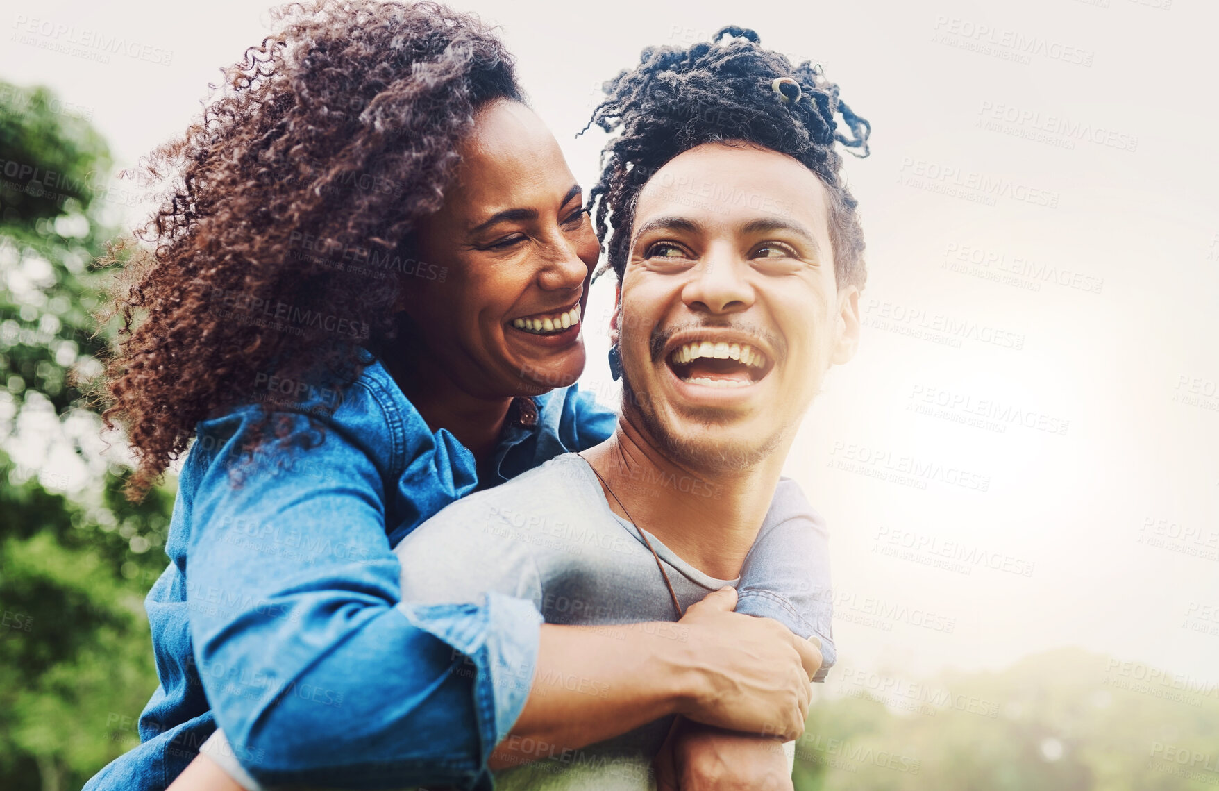 Buy stock photo Couple, piggyback and smile for love, outdoor and happy in relationship, commitment and trust in date. Relax, fun and break for romance in weekend, people and joy in park, bokeh and peace in nature