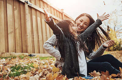 Buy stock photo Asian, woman and girl in outdoor, park or garden with enjoying autumn, playing and fun for bonding. Female person, child and together as mother and daughter family on weekend, break or relax in Japan