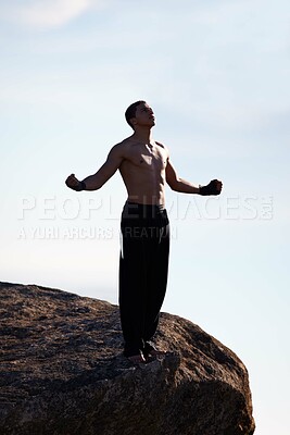 Buy stock photo Mountain top, fitness man and freedom with winner fist in nature for training, wellness or sports on sky background. Exercise, success and male athlete with cardio, gratitude or workout celebration