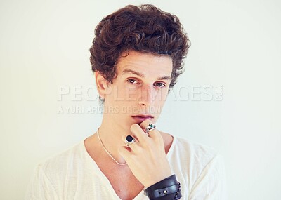Buy stock photo Cool, accessories or portrait of man in studio on a white background for fashion, swag or unique style. Jewelry, bracelet or rings on the fingers of a young male model for trendy or edgy expression