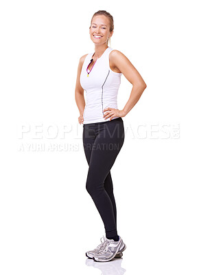 Buy stock photo Full length studio portrait of a sporty young woman smiling at the camera isolated on white