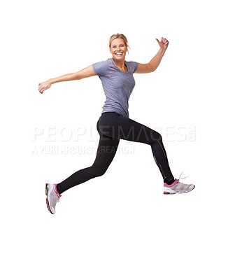 Buy stock photo Woman, running and jump in studio for fitness, workout and training celebration, energy or achievement. Excited portrait of sports model or runner in air for exercise and cardio on a white background