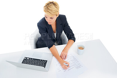 Buy stock photo Business woman, laptop and documents in studio for accounting, taxes management and budget report. Professional accountant writing at her desk with computer and paperwork on a white background above
