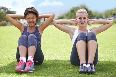 Buy stock photo Woman, portrait and friends in sit ups for fitness, workout or outdoor exercise together on green grass. Young active female person or people smile for core strength and training on field in nature