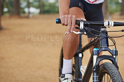 Buy stock photo Hands, bicycle and gear in forest for cycling adventure on off road terrain for extreme sport, performance or cardio. Person, fingers and shifter on mountain gravel or racing, competition or training