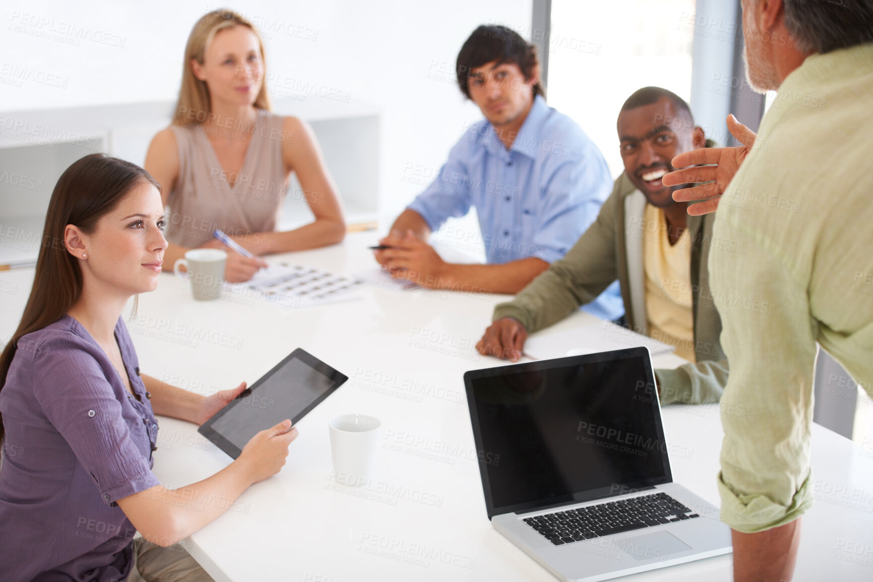 Buy stock photo A team of coworkers at a creative agency brainstorming for a new project in the boardroom