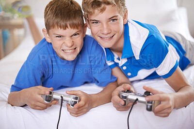 Buy stock photo Children, excited and portrait of video game in home, love and happy for online gaming in bedroom. Young brothers, smile and face for streaming sports on bed, bonding and relax together on weekend