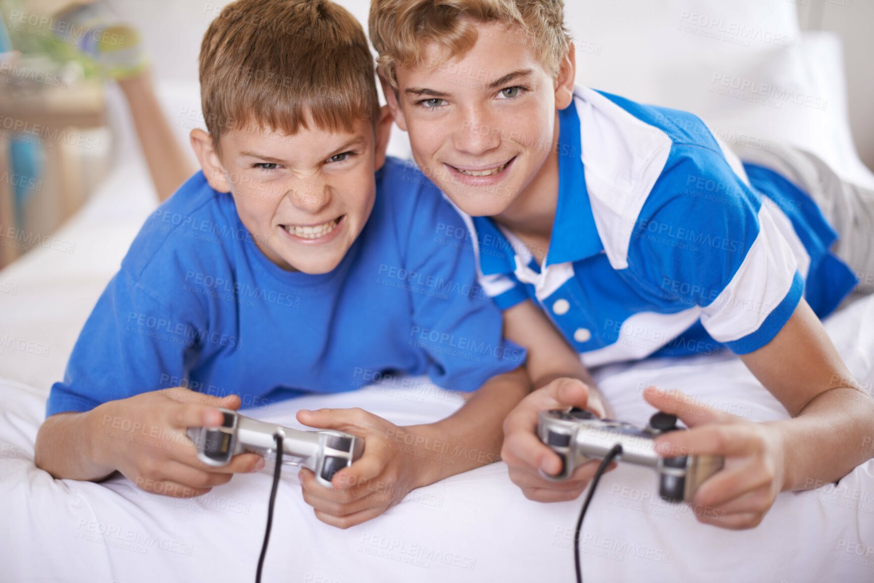 Buy stock photo Children, excited and portrait of video game in home, love and happy for online gaming in bedroom. Young brothers, smile and face for streaming sports on bed, bonding and relax together on weekend