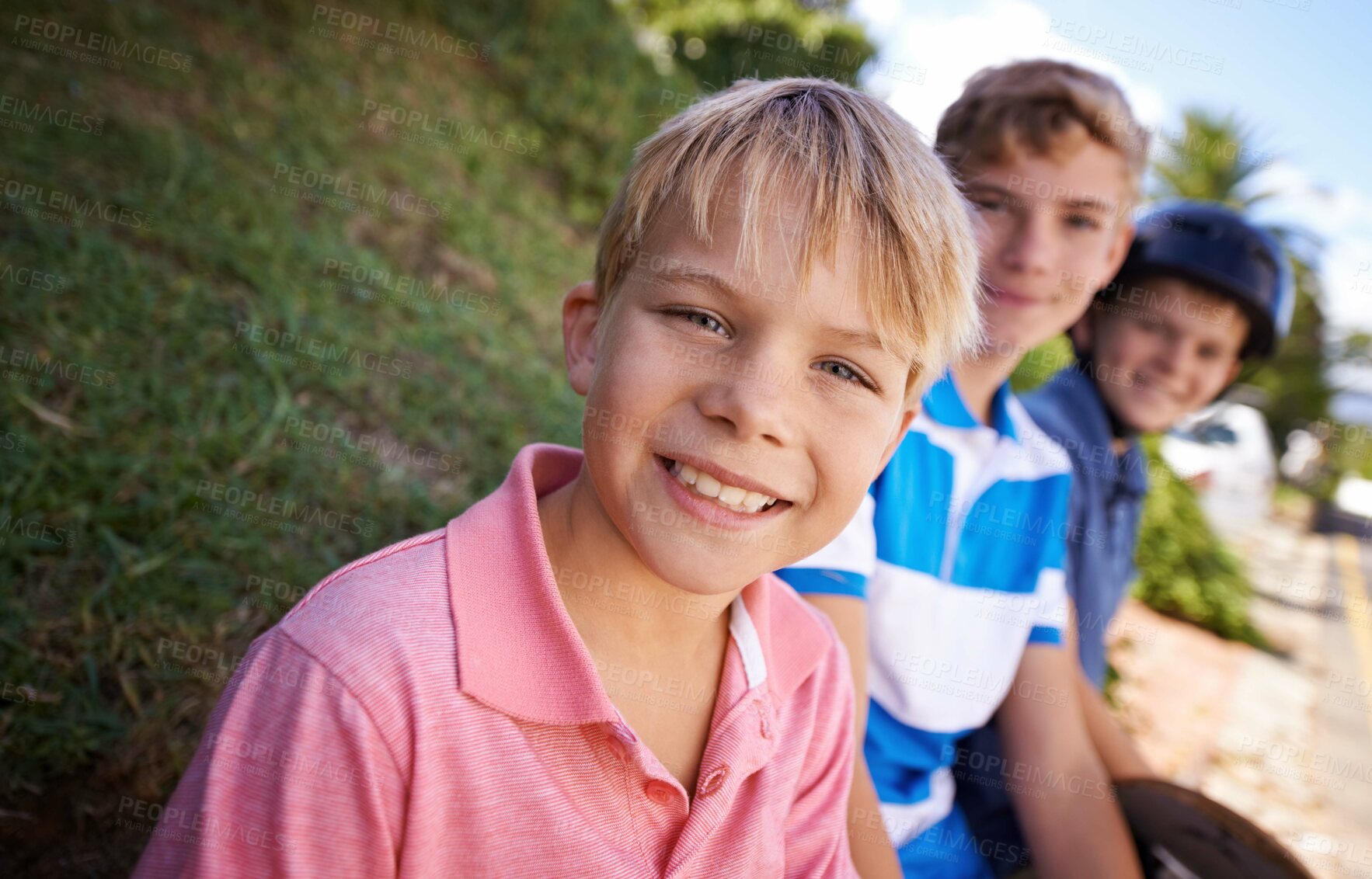 Buy stock photo Portrait, smile and children friends skating outdoor together for fun, leisure or recreation in summer. Face, sports and group of kids on sidewalk or street of neighborhood for skateboarding 