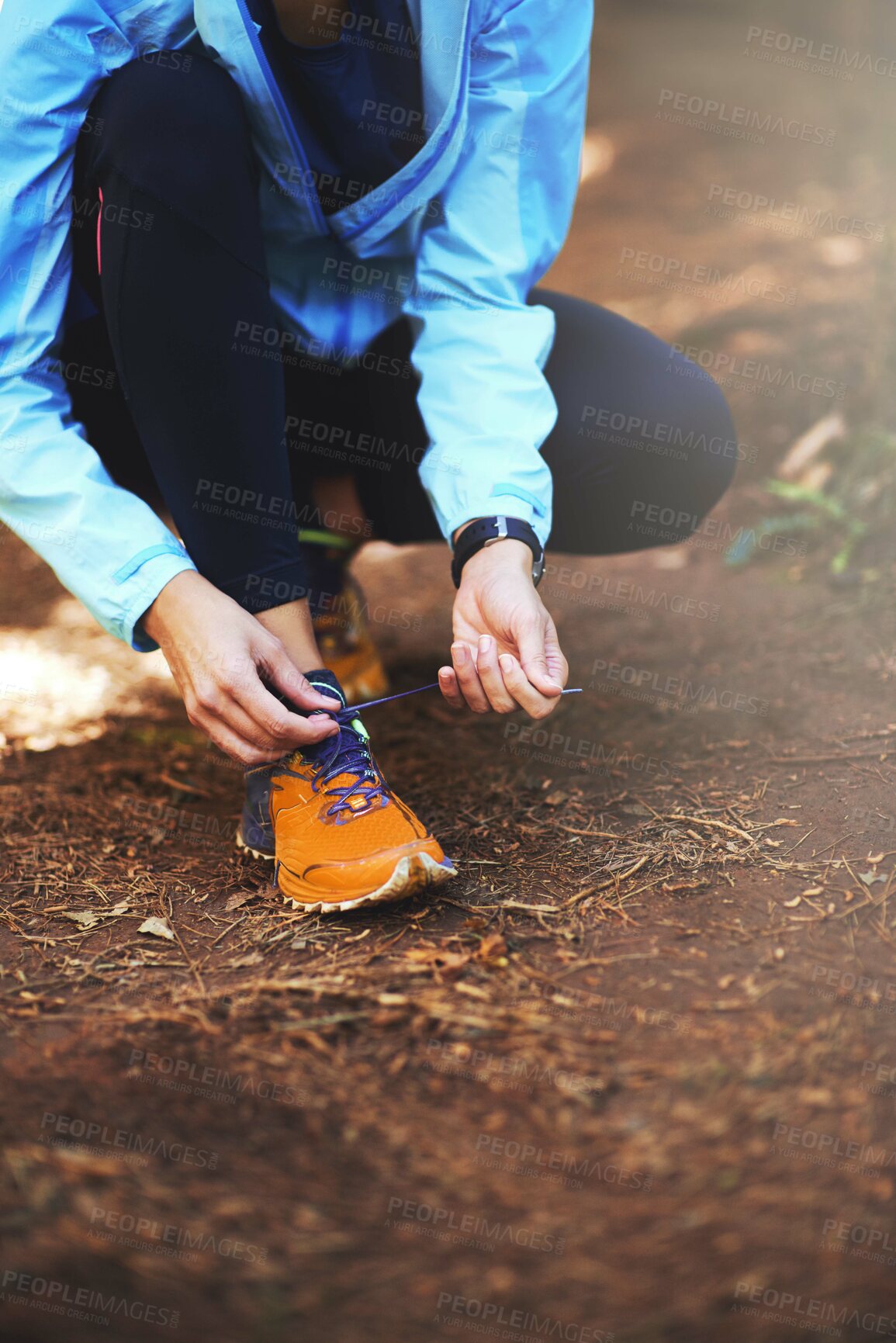 Buy stock photo Hands, runner and outdoor to tie shoelace on ground for training, exercise or fitness to start morning. Person, athlete and prepare with shoes, sneakers and workout for health on countryside path