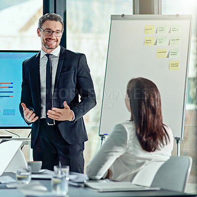 Buy stock photo Cropped shot of a businessman delivering a presentation in the boardroom