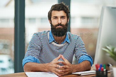 Buy stock photo Portrait, creative and confident business man at desk in office by computer in startup company. Face, serious professional or entrepreneur, designer or employee working at table in Germany for career