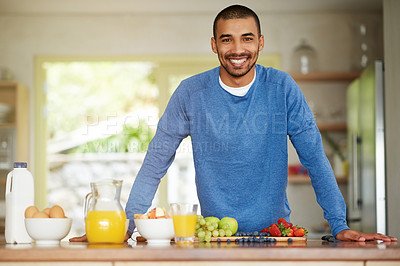 Buy stock photo Man, portrait and healthy fruit for breakfast nutrition or meal prep as gut health, wellness or antioxidants. Male person, face and smile at kitchen counter with orange juice or organic, eggs or home