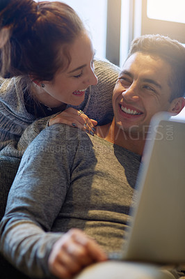 Buy stock photo Happy, couple and relax on sofa at house together in living room with affection, bonding and love on weekend. Smile, man and woman in relationship in lounge with care on laptop  for entertainment