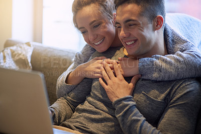 Buy stock photo Smile, couple and relax on sofa at house together in living room with affection, bonding and love on weekend. Happy, man and woman in relationship in lounge streaming on laptop for film entertainment