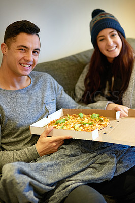 Buy stock photo Man, woman and portrait with pizza on couch with smile for nutrition, fast food and together in apartment. Couple, meal and happy with face on sofa for dinner, weekend and hungry people in London 