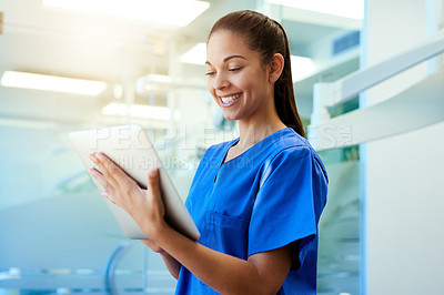 Buy stock photo Woman, nurse and reading on tablet in clinic for medical research, telehealth and digital consultation. Medicine, professional and happy in hospital for patient data, medicare schedule and results