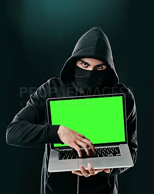 Buy stock photo Man, portrait and laptop on black background for hacking, phishing and malware with green screen. Hacker, technology and software for cyber crime, hacktivism or cryptocurrency thief with mockup space