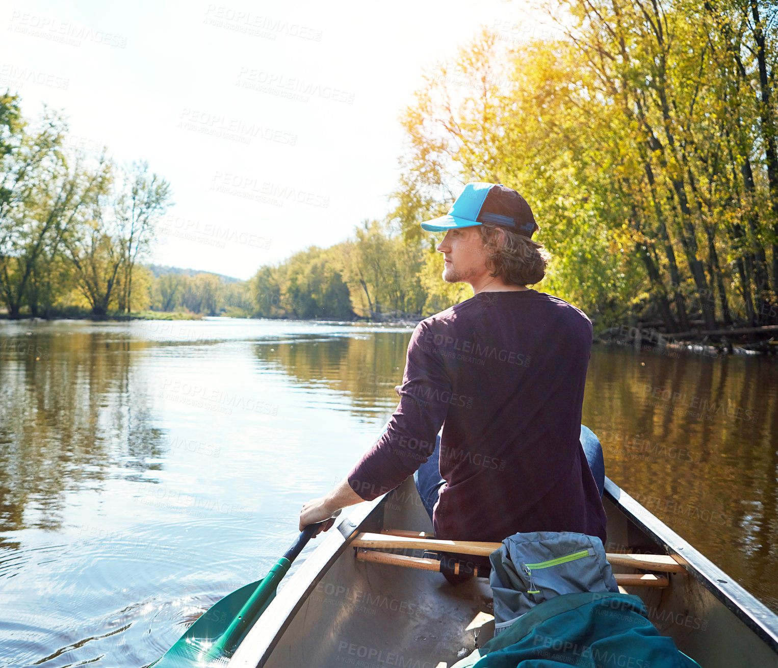 Buy stock photo Man, canoeing and lake rowing in woods for morning adventure for exercise, exploring or island. Male person, river and Colorado traveling for outdoor hobby with boat at camp site, forest or nature