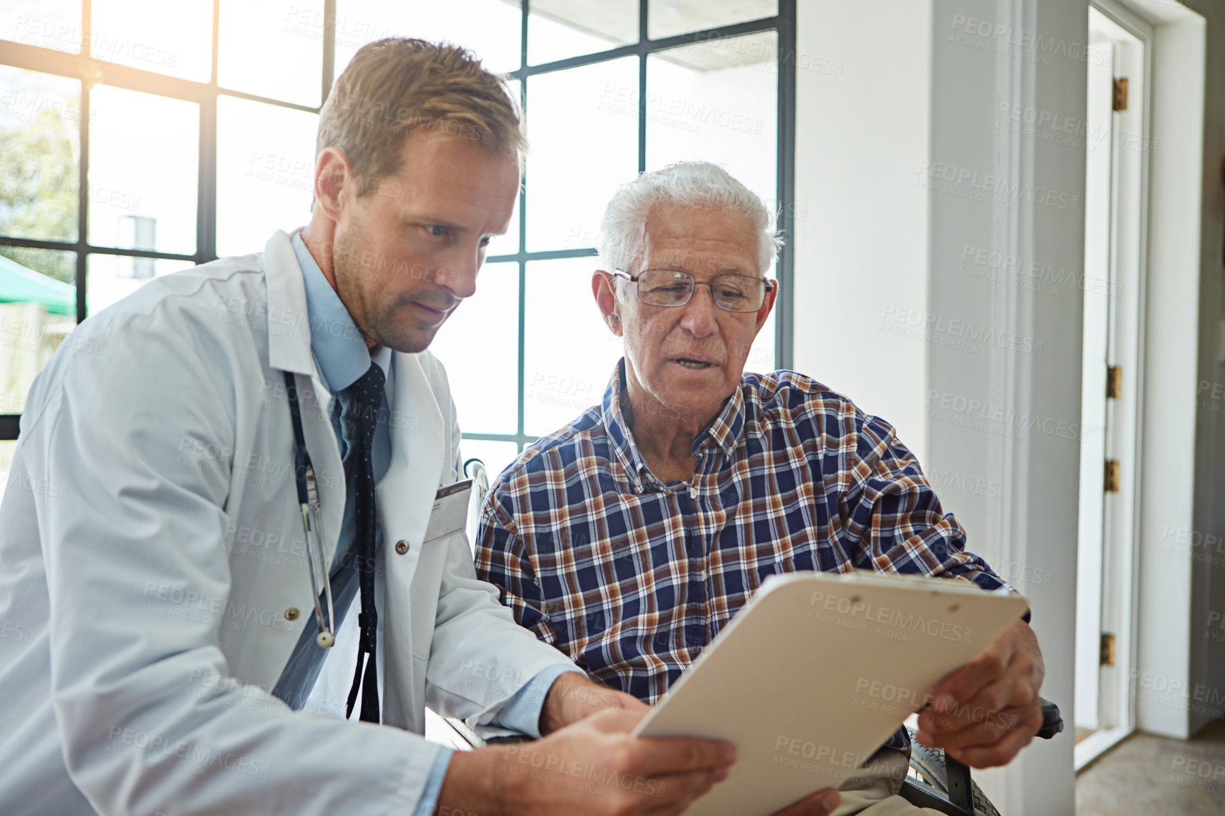 Buy stock photo Doctor, man and wheelchair with clipboard in clinic for consultation, report or medical review. Medic, checklist and person with disability in hospital for paperwork, exam and rehabilitation for care