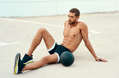 Buy stock photo Male athlete, rest and body with medicine ball for sports, exercise and fitness on break. Healthy, man and topless in workout, cardio and wellness for muscle, strong and training for mental wellbeing