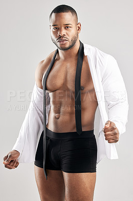 Buy stock photo Studio, black man and portrait for fitness, model and muscle in shirt, strong and serious with training. White background, healthy and face of person, bodybuilder and workout for body and underwear