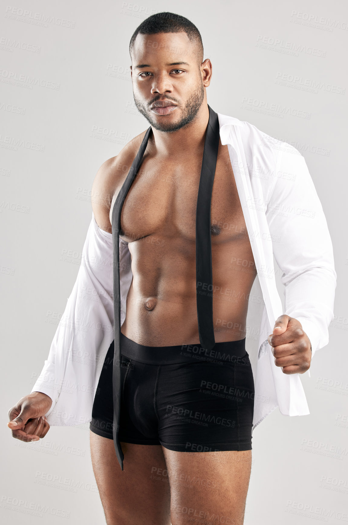 Buy stock photo Studio, black man and portrait for fitness, model and muscle in shirt, strong and serious with training. White background, healthy and face of person, bodybuilder and workout for body and underwear