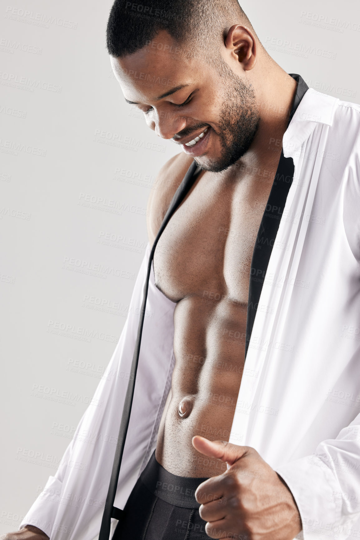 Buy stock photo Studio, black man and sexy for fashion, model and muscle in shirt, strong and smile with training. White background, healthy and face of person, bodybuilder and workout for body and fitness for pride