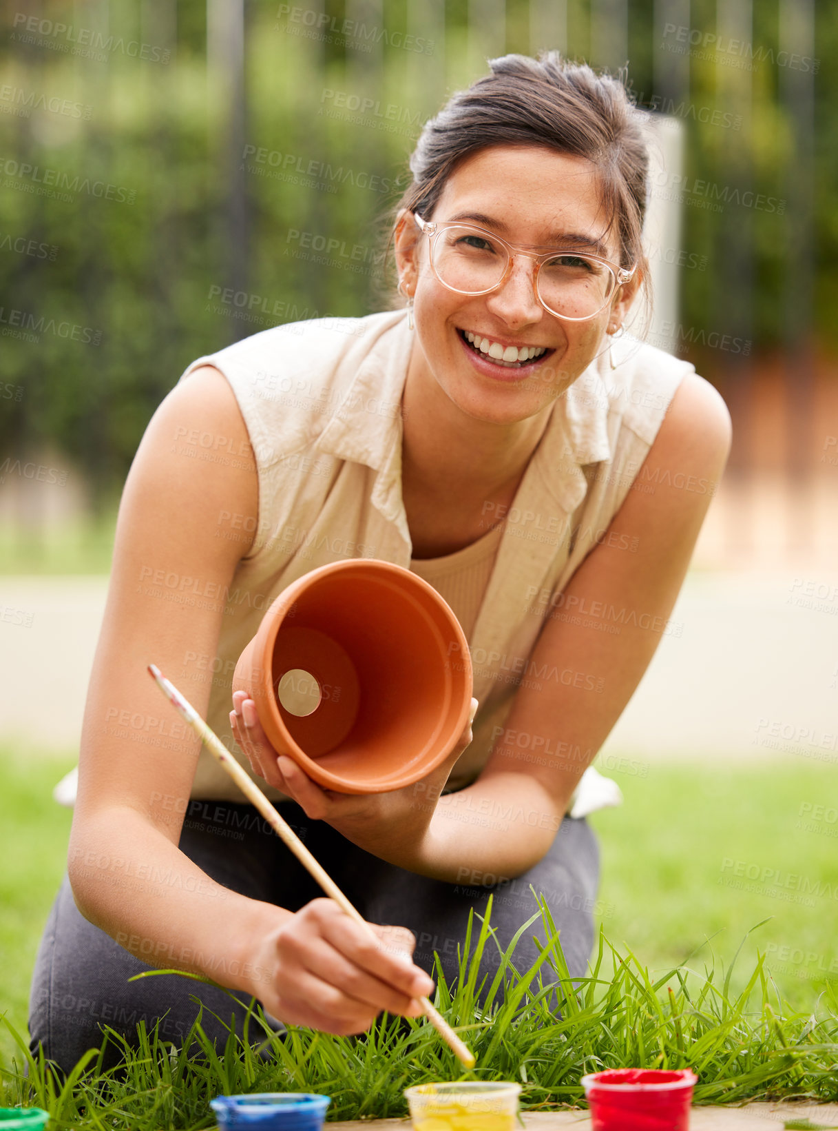 Buy stock photo Ceramic, pot and portrait of girl painting a craft container for plant in garden with creativity in hobby. Clay, art and artist with inspiration outdoor with paint brush, decoration or fun project