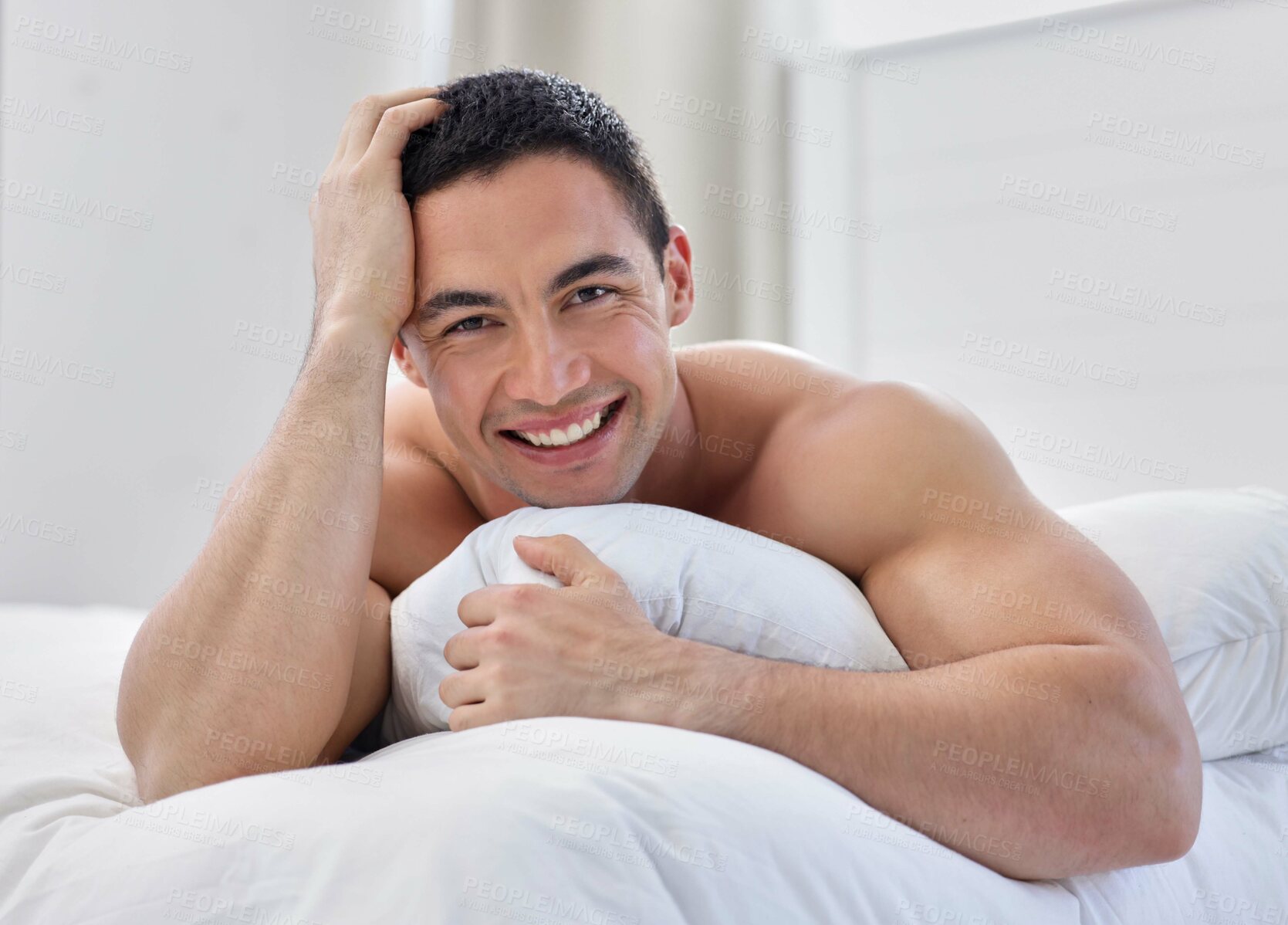 Buy stock photo Shirtless, portrait or happy man in bedroom with blanket, cover or pillow for resting in home, house or morning. Wake up, relax or person sleeping on break with smile or wellness on weekend chill