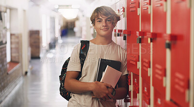 Buy stock photo Boy, portrait and hallway as high school student by lockers with books for education, scholarship or campus. Male person, face and learning development with backpack in corridor, academic or study