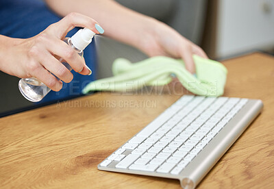 Buy stock photo Hands, keyboard and spray bottle with a person cleaning a keyboard on a wooden desk for hygiene. Technology, health and sanitize with an adult wiping a wireless device on a table