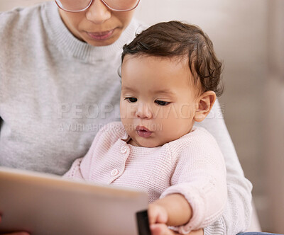 Buy stock photo Tablet, relax and mom with baby on sofa watching movie, video or show together in living room. Love, bonding and mother with girl child, kid or toddler streaming film on digital technology at home.