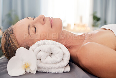 Buy stock photo Relax, massage and woman with luxury, spa and wellness with grooming, stress relief and pamper treatment. Female person, mature customer and client on a bed, body care and resort for peace and health