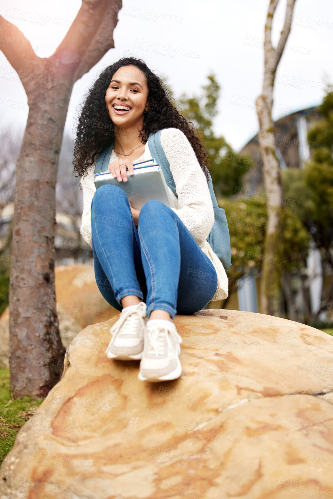 Buy stock photo Outdoor, university and portrait of woman with book on campus for learning, knowledge and studying. Education, college and happy female student laugh with textbook for information, research or lesson