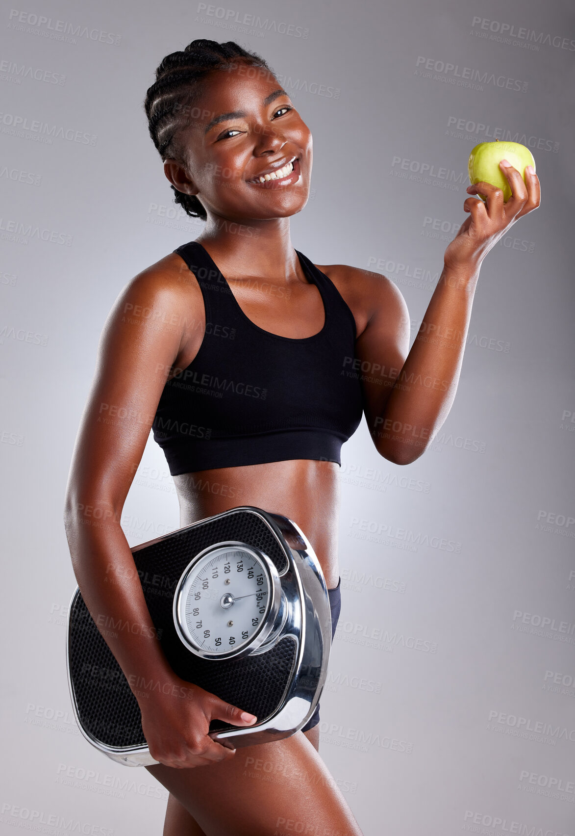 Buy stock photo Studio, portrait and woman for lose weight with scale, measure and tracking health goals by mockup. Black female model, diet and organic fruit for vitamin c, nutrition and wellness by gray background