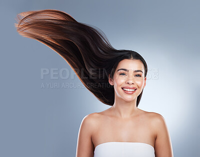 Buy stock photo Hair care, wind and portrait of woman in studio with natural, beauty and salon treatment. Smile, health and female person with shampoo shine for silky hairstyle by gray background with mockup space.