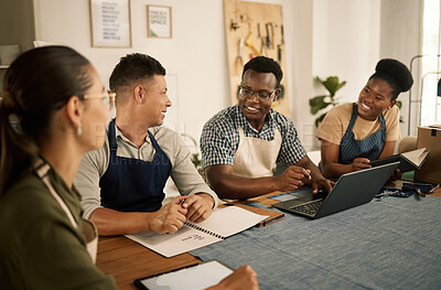 Buy stock photo A group of clothing style and fashion designers working together as a team, taking notes and doing research on a laptop. An excited, positive and trendy bunch of professionals collaborating.