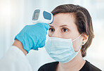 Covid, thermometer being used to screen woman with mask by doctor or health professional in hospital. Female patient test for healthcare, safety and protection against illness or virus at clinic. 