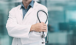 Healthcare, leader and doctor with stethoscope in hand, boss at hospital or clinic cropped. Help, success and support, confident medical professional or health care employee with leadership at work.