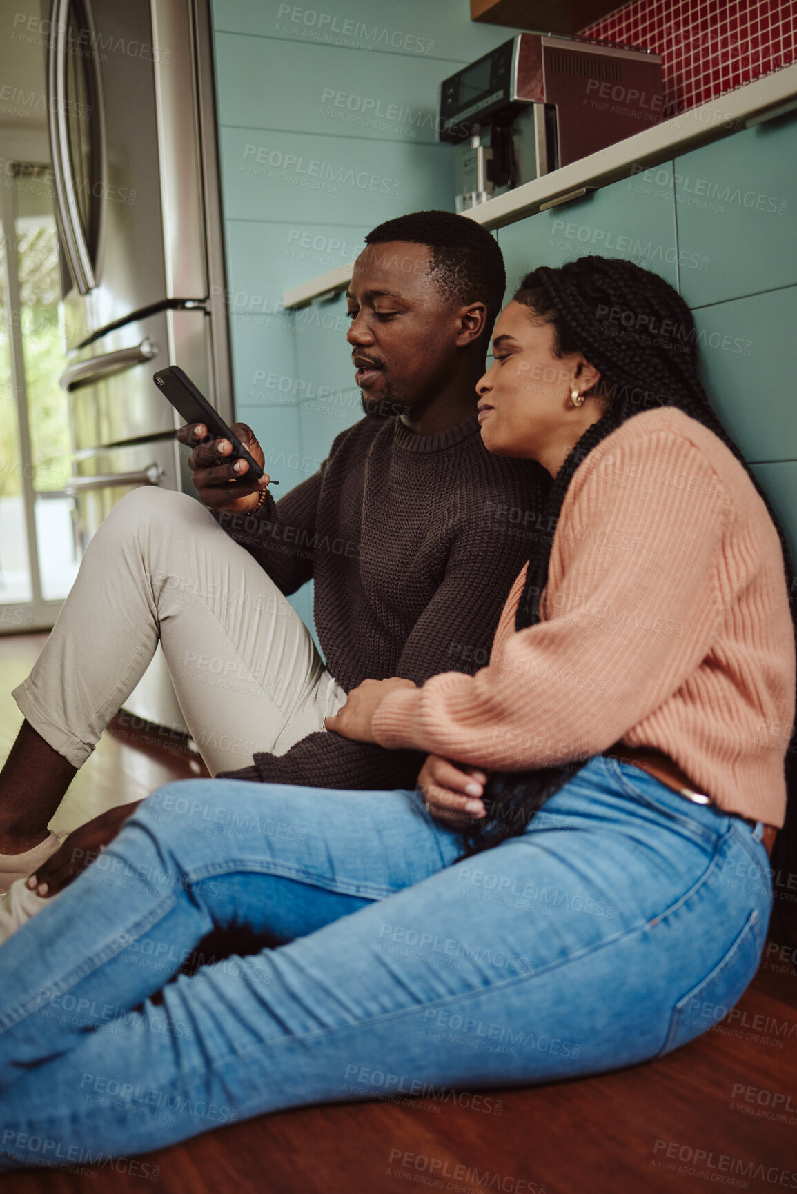 Buy stock photo Black couple, phone and streaming at home while online on internet together for social media or online shopping. Young man and woman talking while at home to relax and use communication app