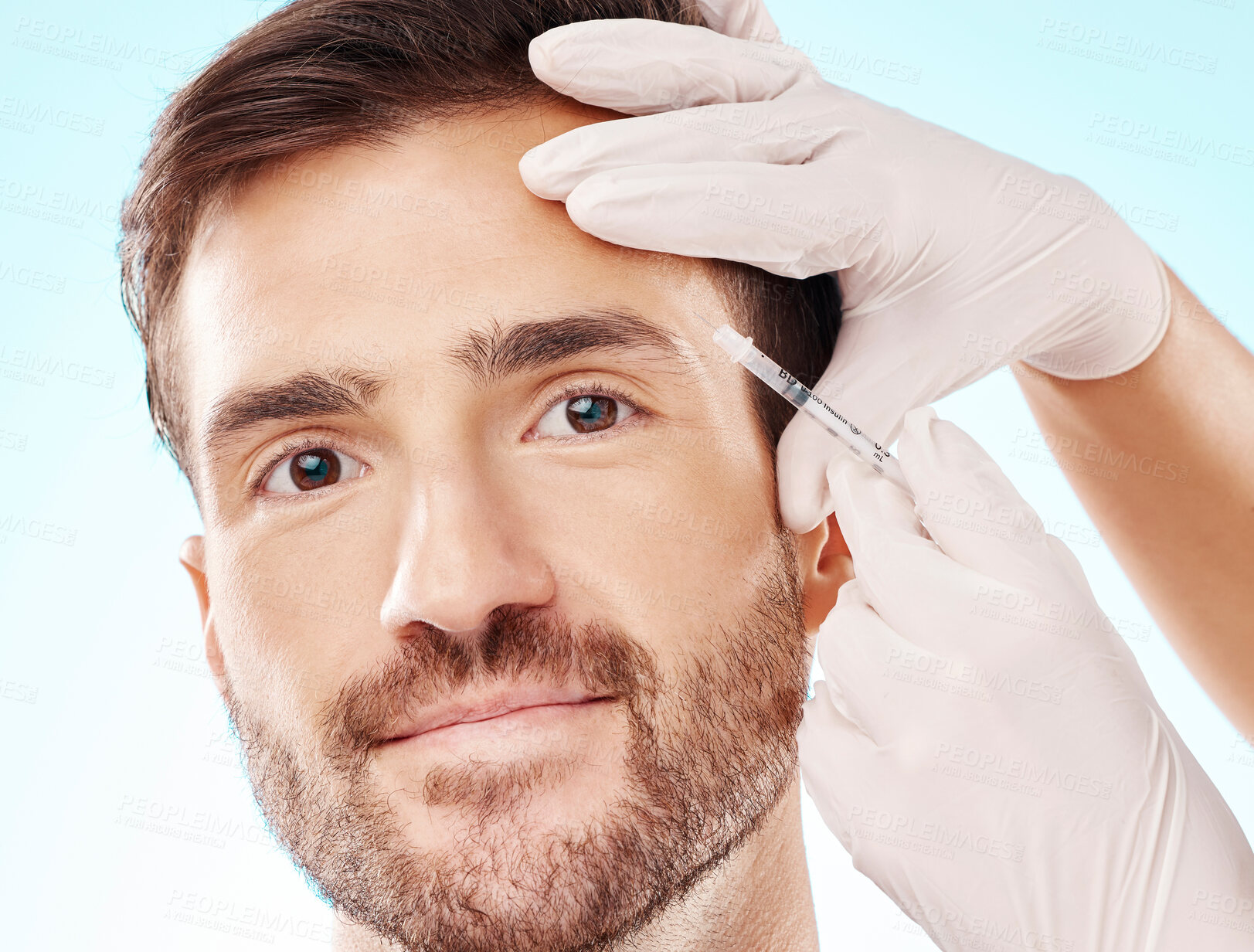 Buy stock photo Portrait, man and needle for cosmetics, dermatology and beauty on blue studio background. Face, male and gentleman with skincare, injection and plastic surgery gloves for facial change