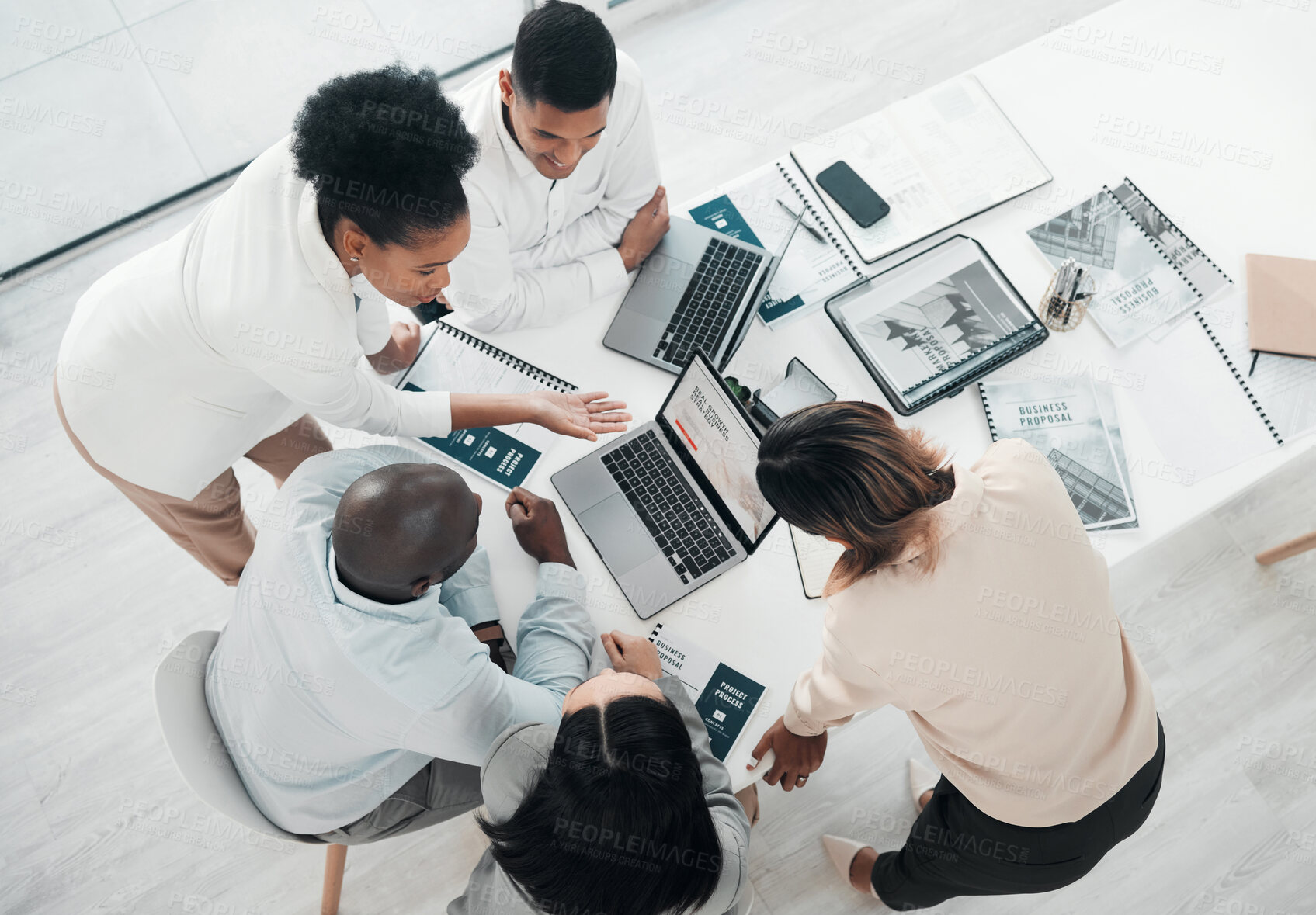 Buy stock photo Business people, laptop and meeting in planning above for web design, strategy or brainstorming at the office. Top view of group designers working on computer for team project plan or idea on table