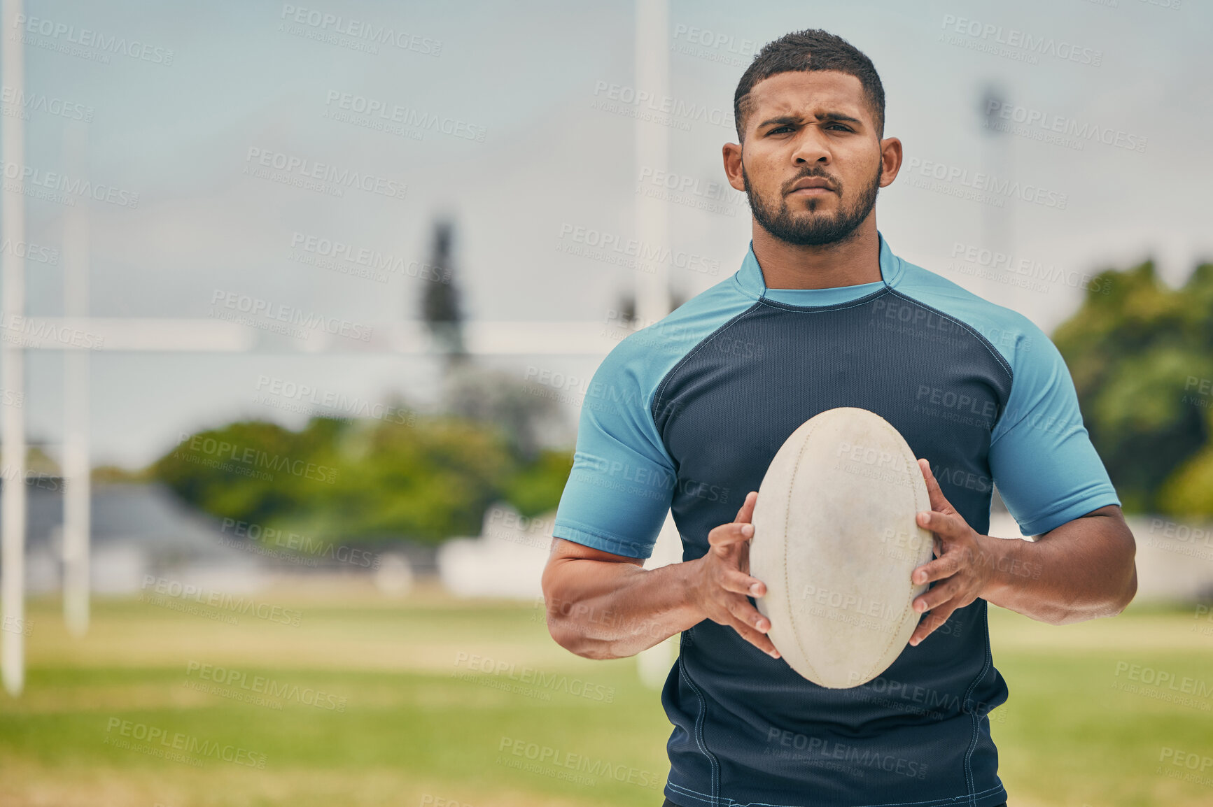 Buy stock photo Rugby, field and portrait of man with ball, serious expression and confidence in winning game. Fitness, sports and player training for match, workout or competition on grass at stadium with mockup.